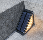 StairMod weatherproof solar LED step lights installed on outdoor paved stairs