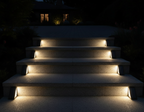 StairMod weatherproof solar LED step lights installed on outdoor paved stairs