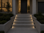StairMod weatherproof solar LED step lights installed on outdoor paved stairs
